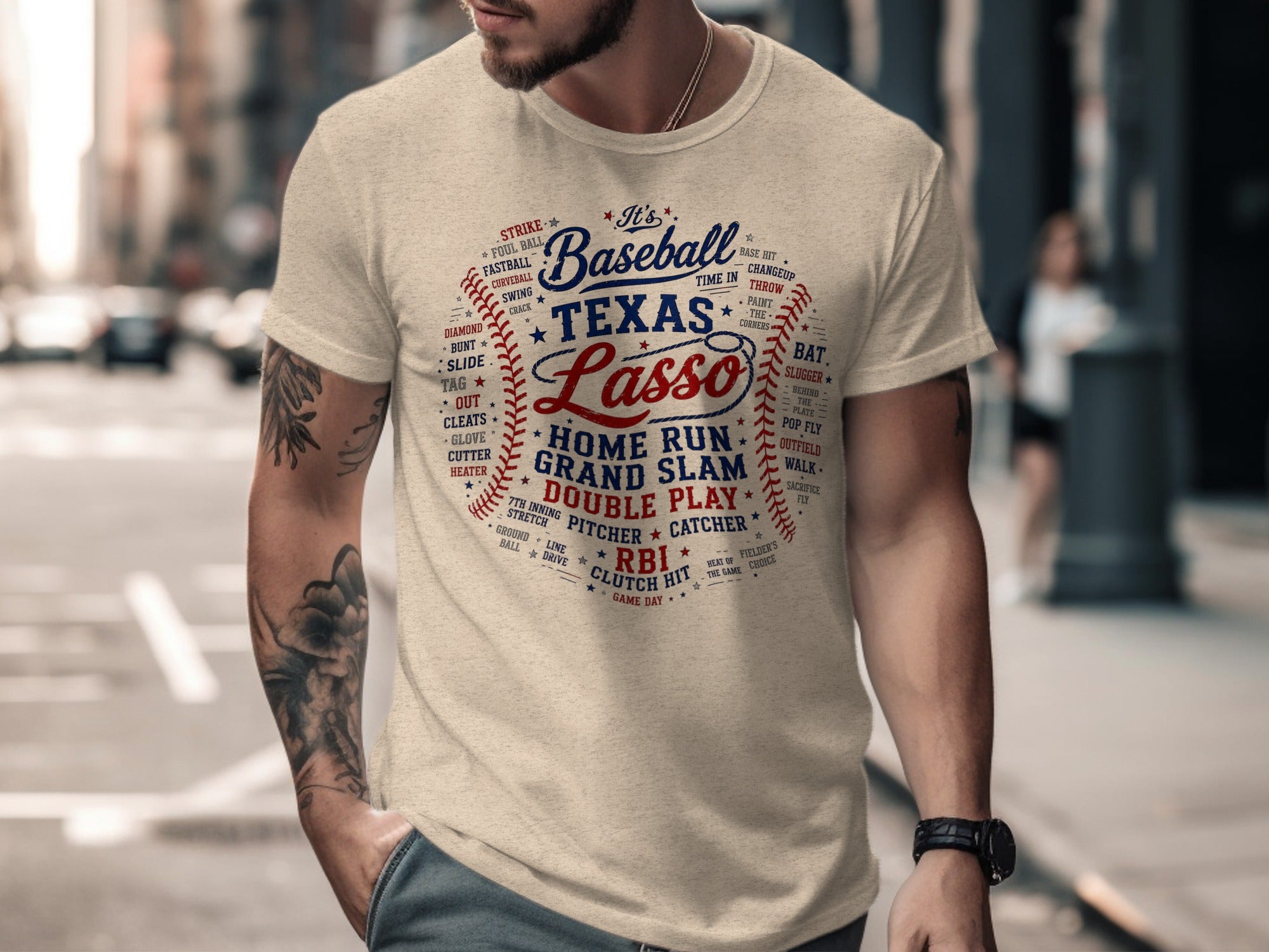 Cream t-shirt with "It's Baseball Texas Lasso" and baseball terms design.