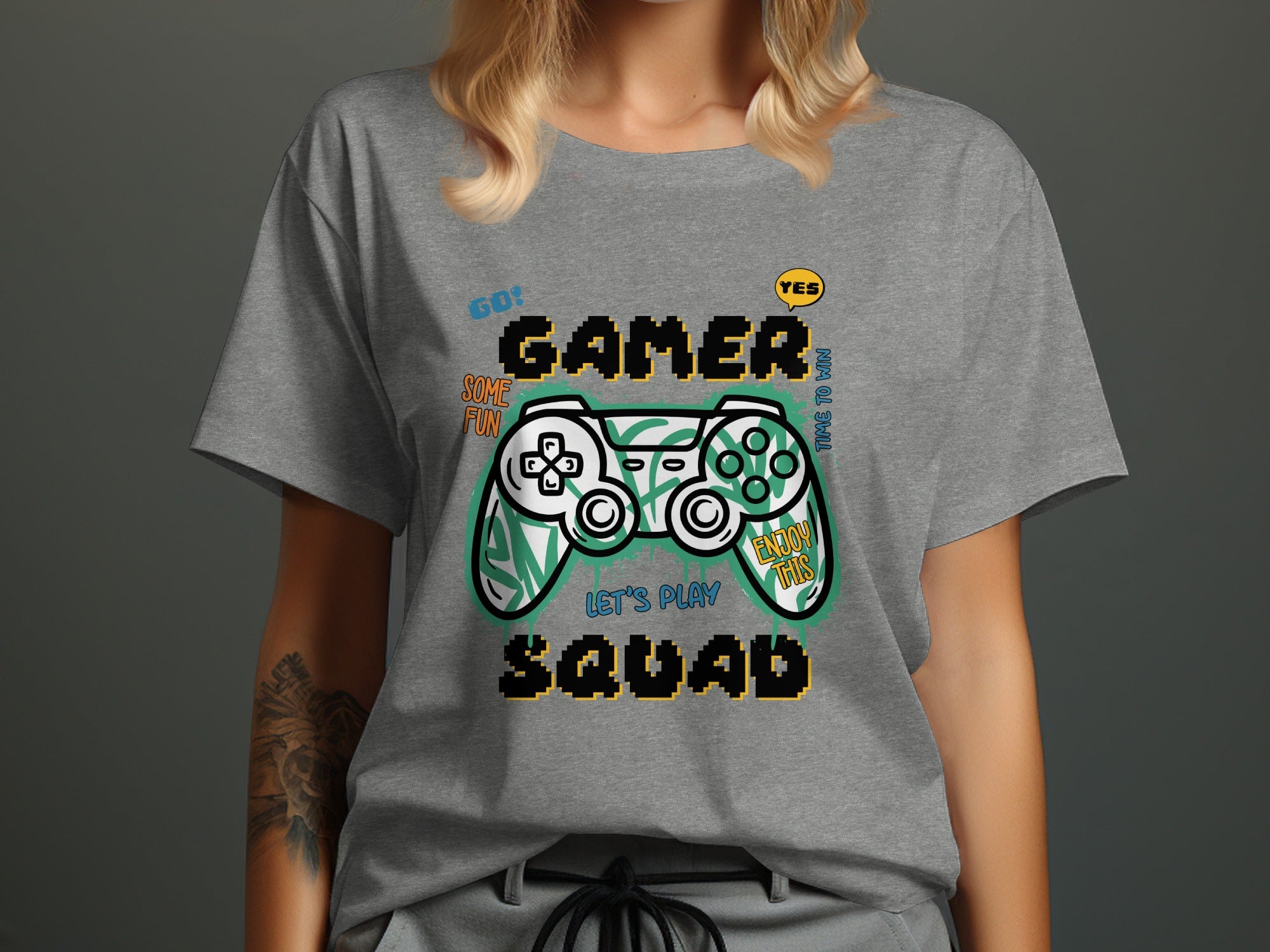 Grey t-shirt with "GO! GAMER SOME FUN LET'S PLAY SQUAD ENJOY THIS" and controller graphic.