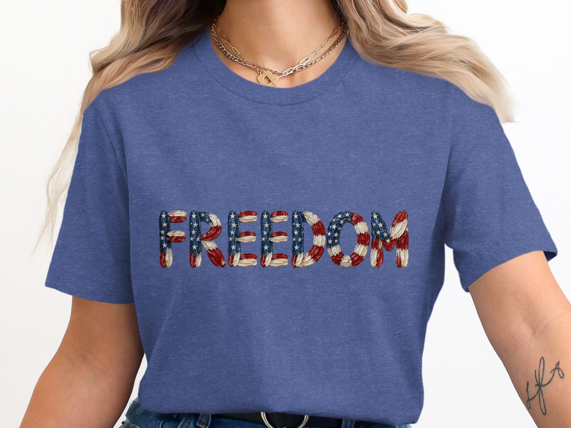 Blue t-shirt with "FREEDOM" text in American flag pattern.
