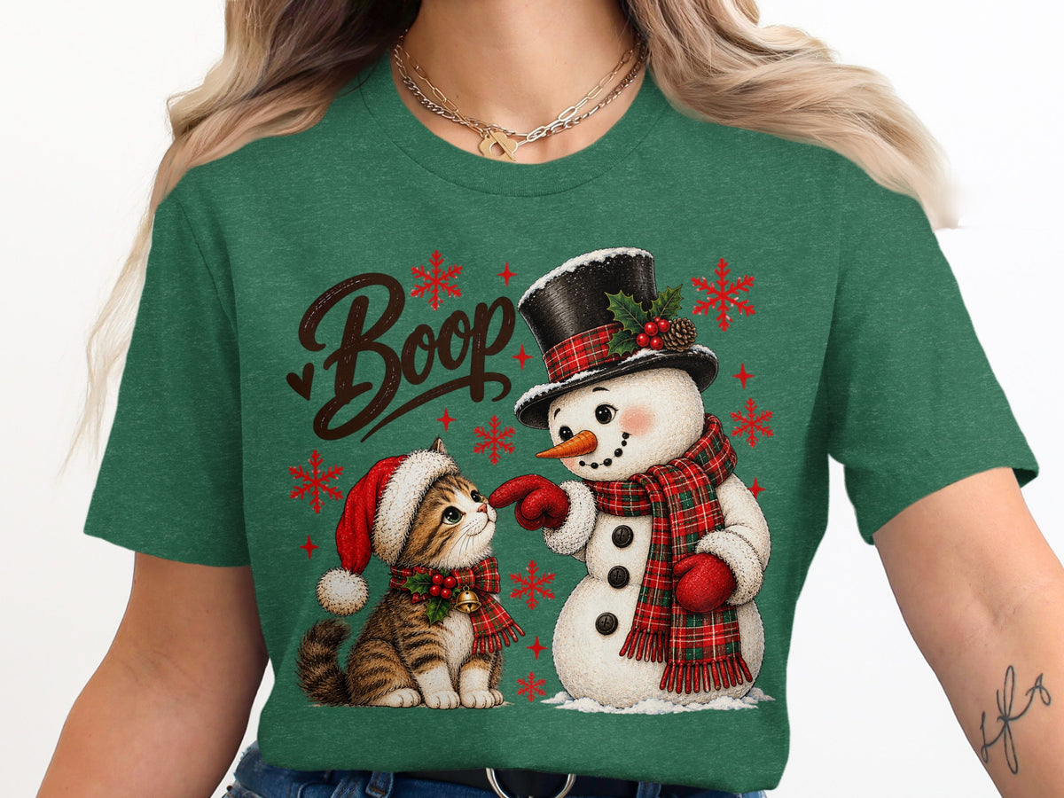 Christmas graphic with "Boop" text, snowman, and kitten on green shirt.