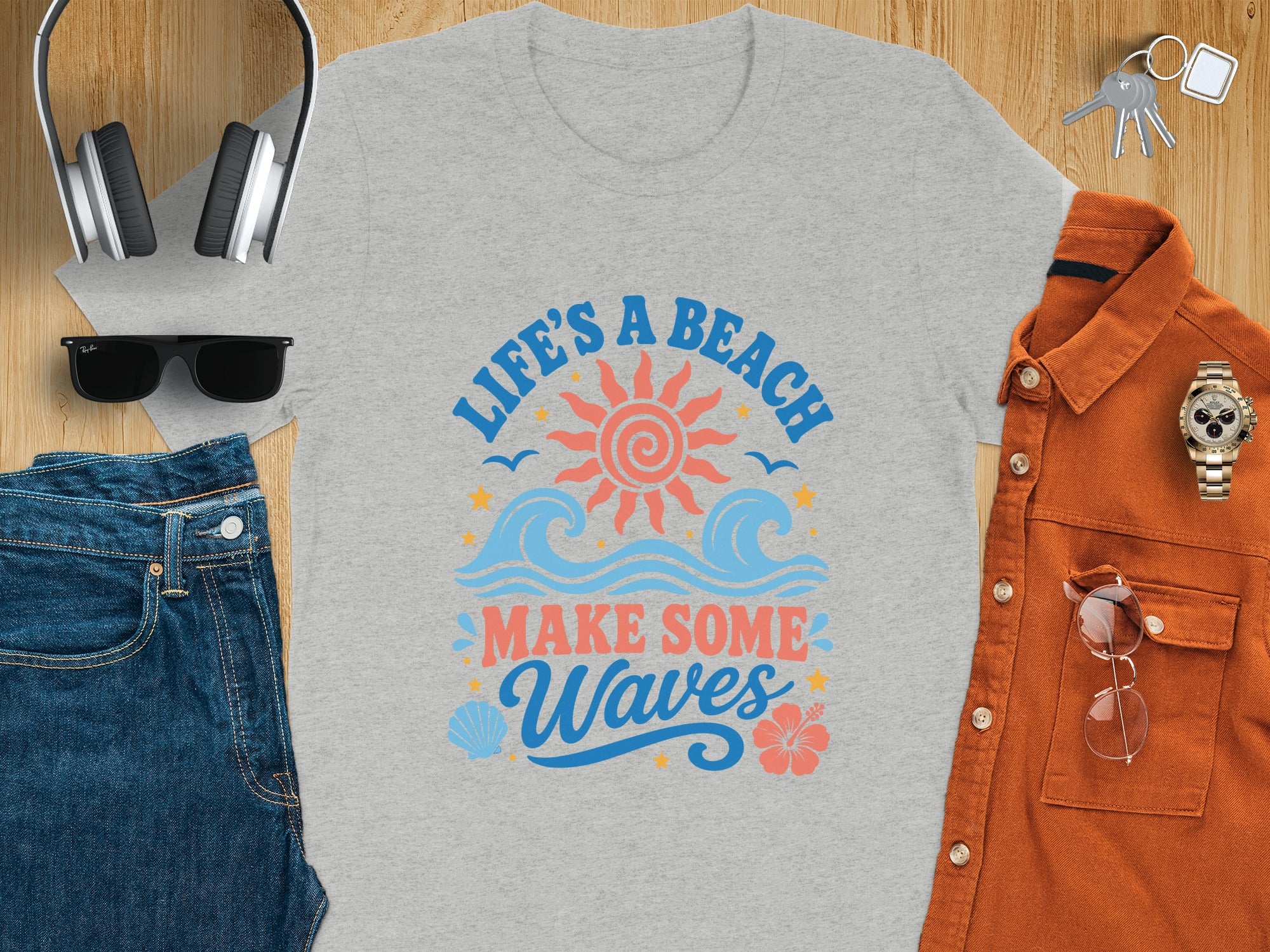 Gray t-shirt with "Life's A Beach Make Some Waves" graphic and beach imagery.