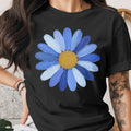 Black t-shirt with a large blue daisy graphic with a yellow center.