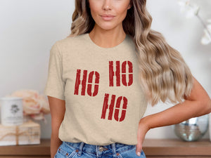 Beige t-shirt with red "Ho Ho Ho" text graphic.