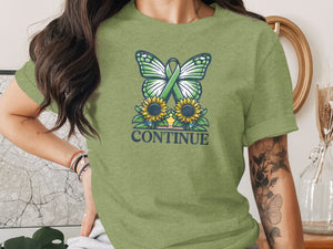 Green butterfly with awareness ribbon over sunflowers, text "CONTINUE".