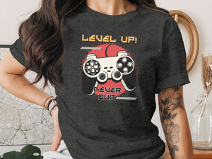 Dark t-shirt with "Level Up! Never Quit" and a retro joystick graphic.