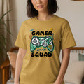 Yellow t-shirt with "Gamer Squad Let's Play" and pixelated controller design