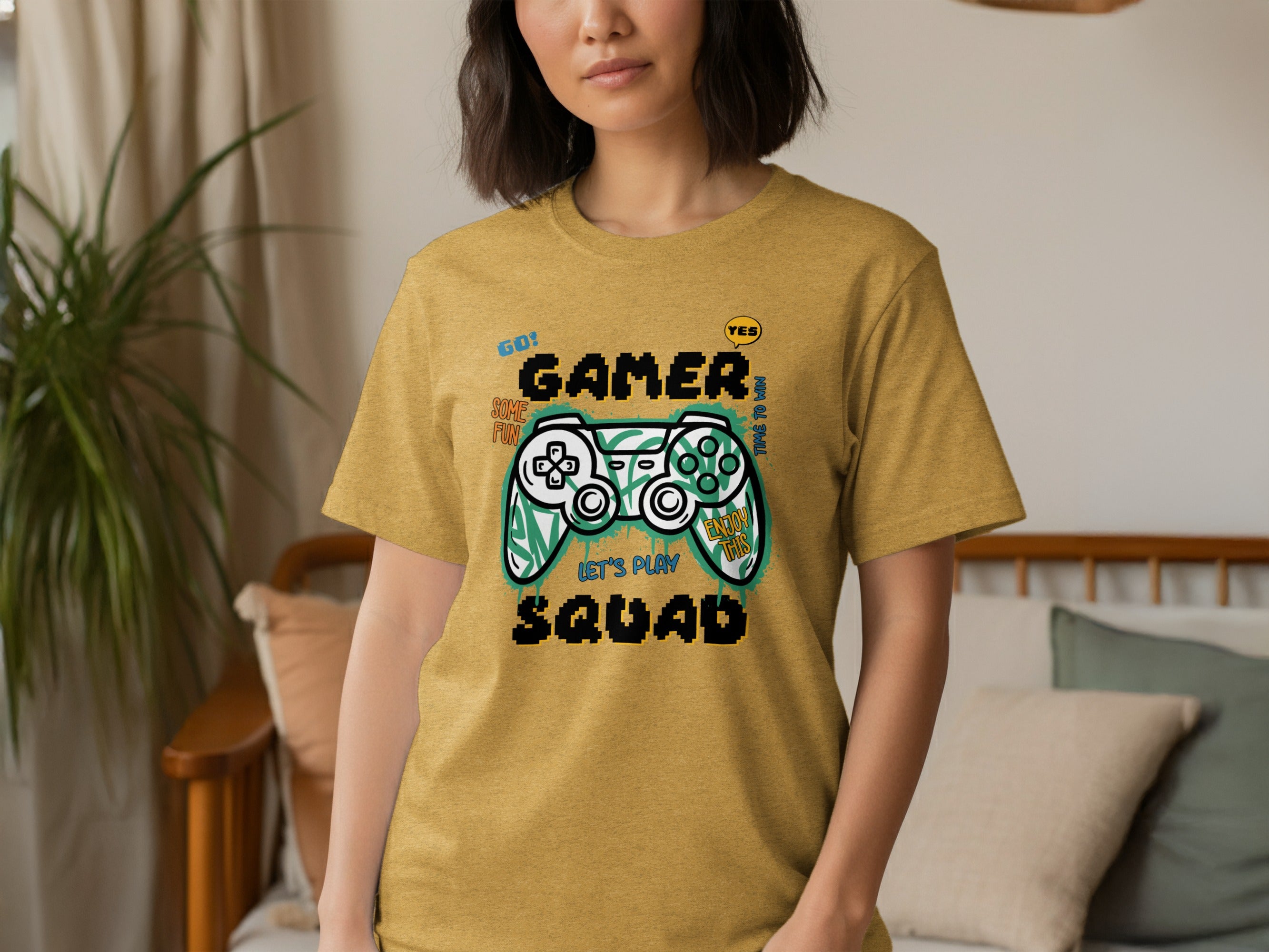 Yellow t-shirt with "Gamer Squad Let's Play" and pixelated controller design