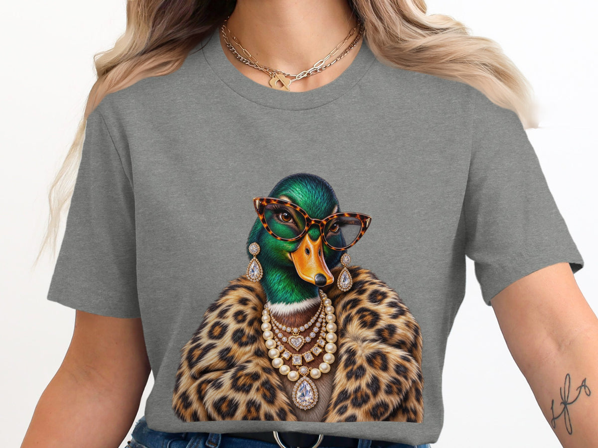 Duck wearing glasses, fur coat, and jewelry featured on gray t-shirt.