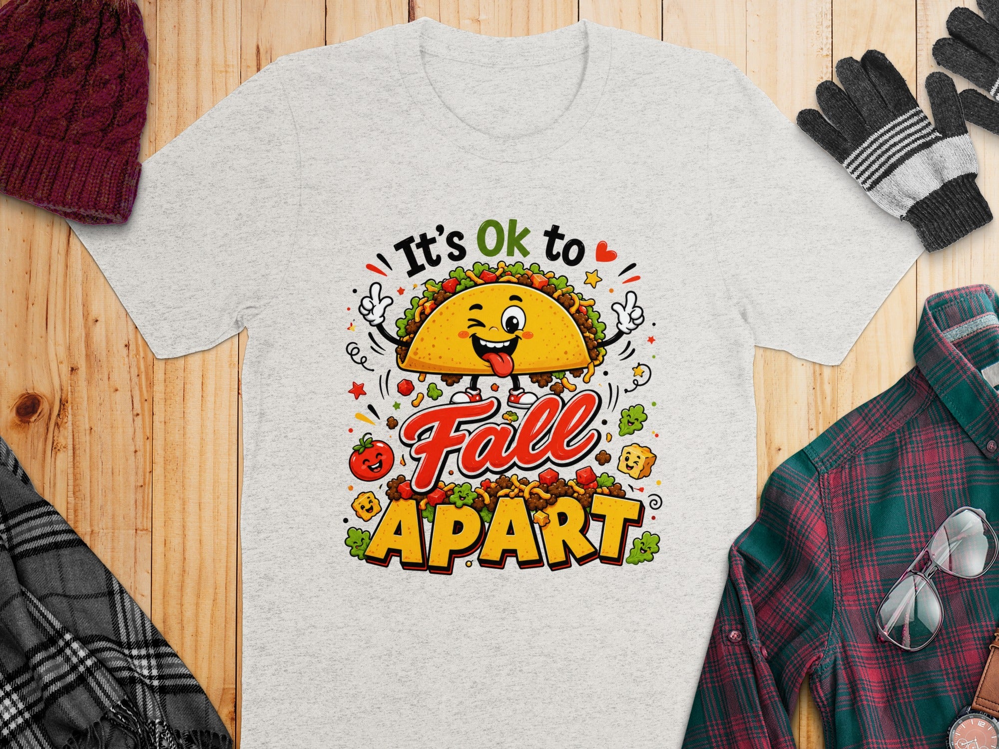 Light grey t-shirt with a cartoon taco and "It's Ok to Fall Apart" text.