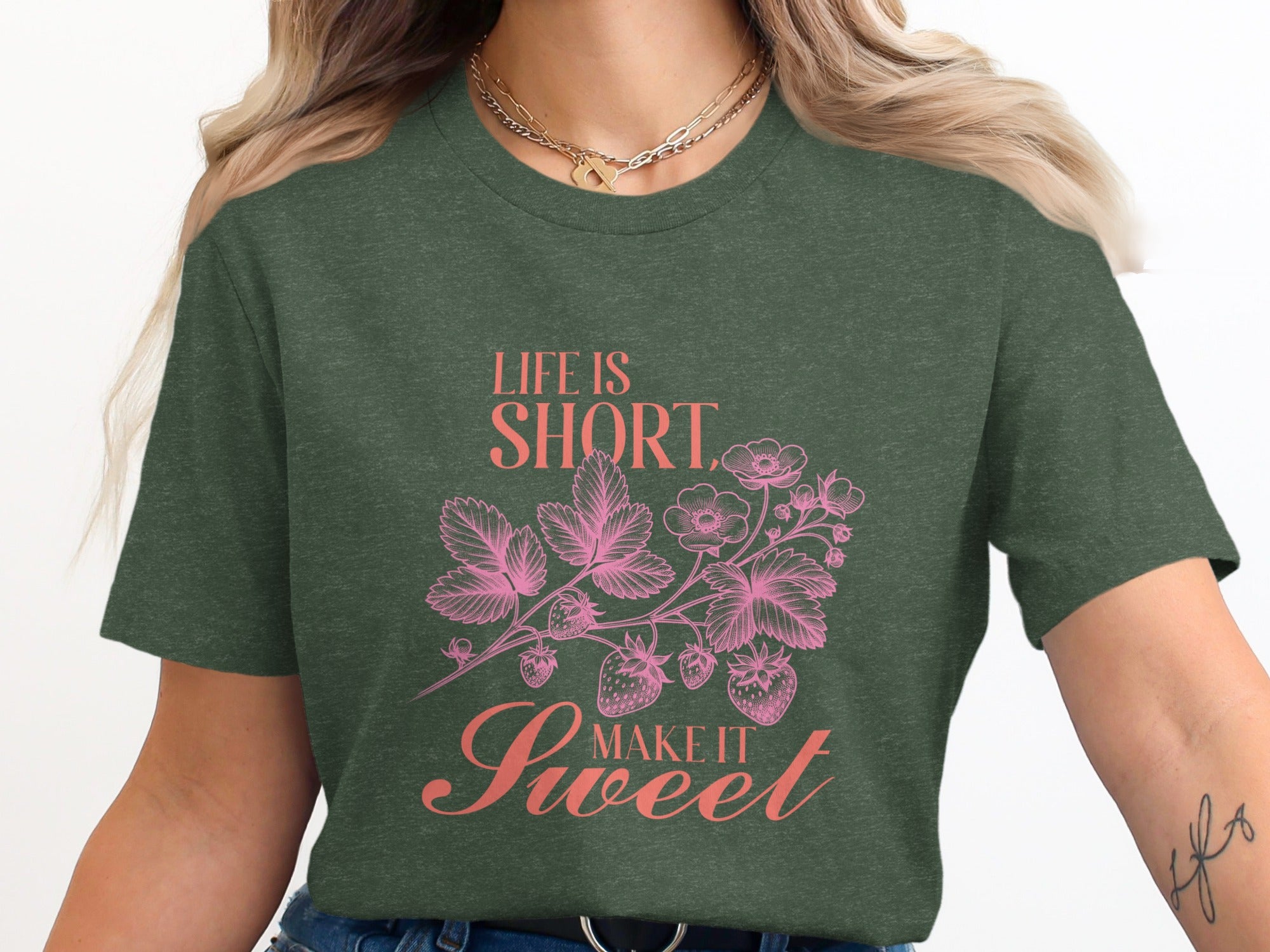 Green T-shirt with pink strawberry floral design and text "Life is Short, Make it Sweet".