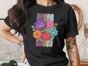 Black t-shirt with a colorful floral bouquet design on a striped background.