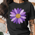 Black t-shirt with a painted purple daisy and gold center graphic.