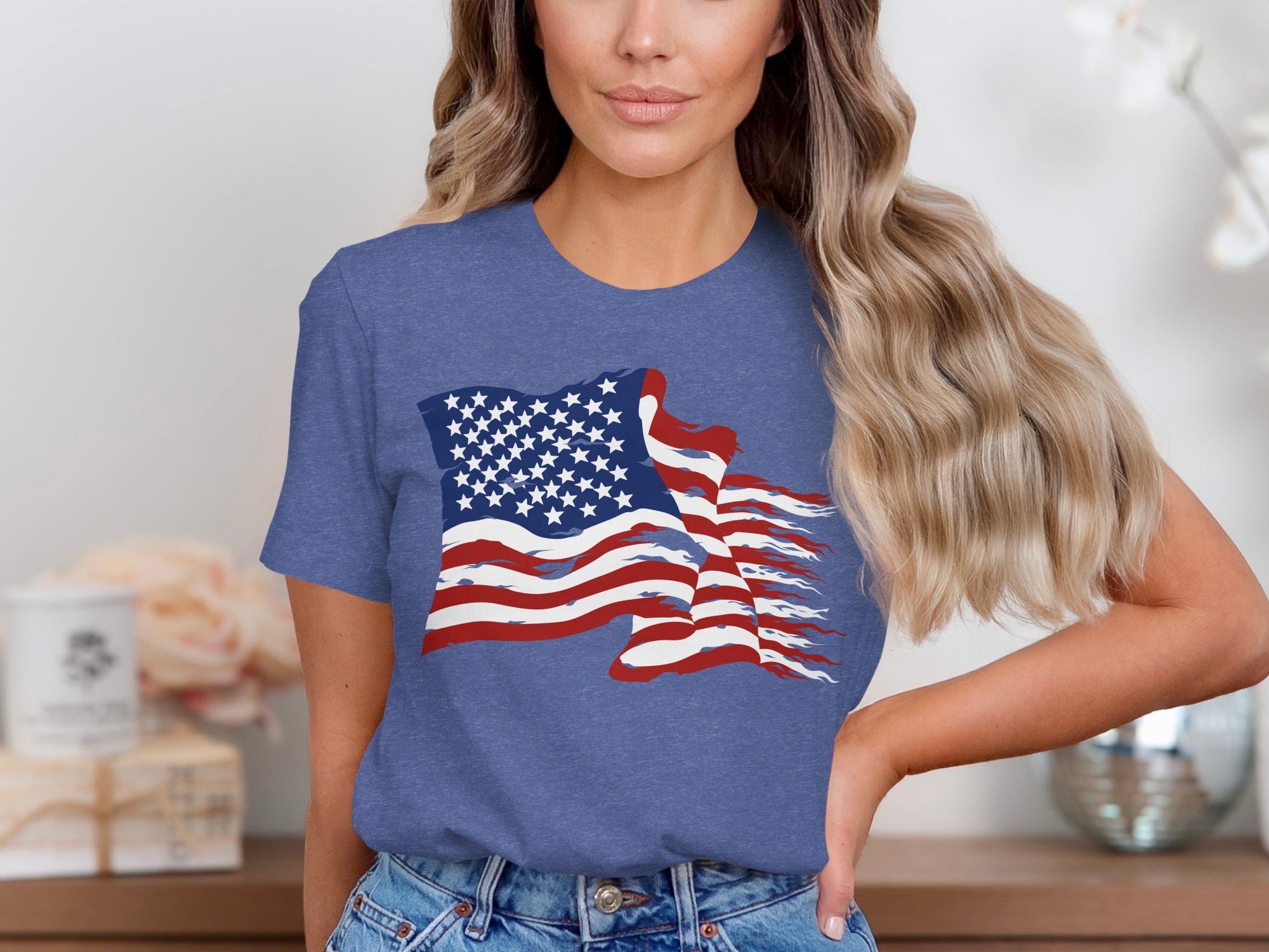 Woman wearing a blue t-shirt with a distressed American flag graphic.