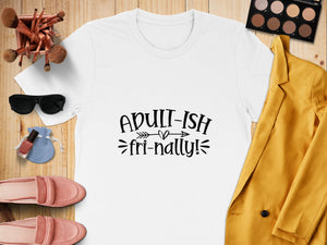 White t-shirt with black text "Adult-ish fri-nally!" and decorative accents.