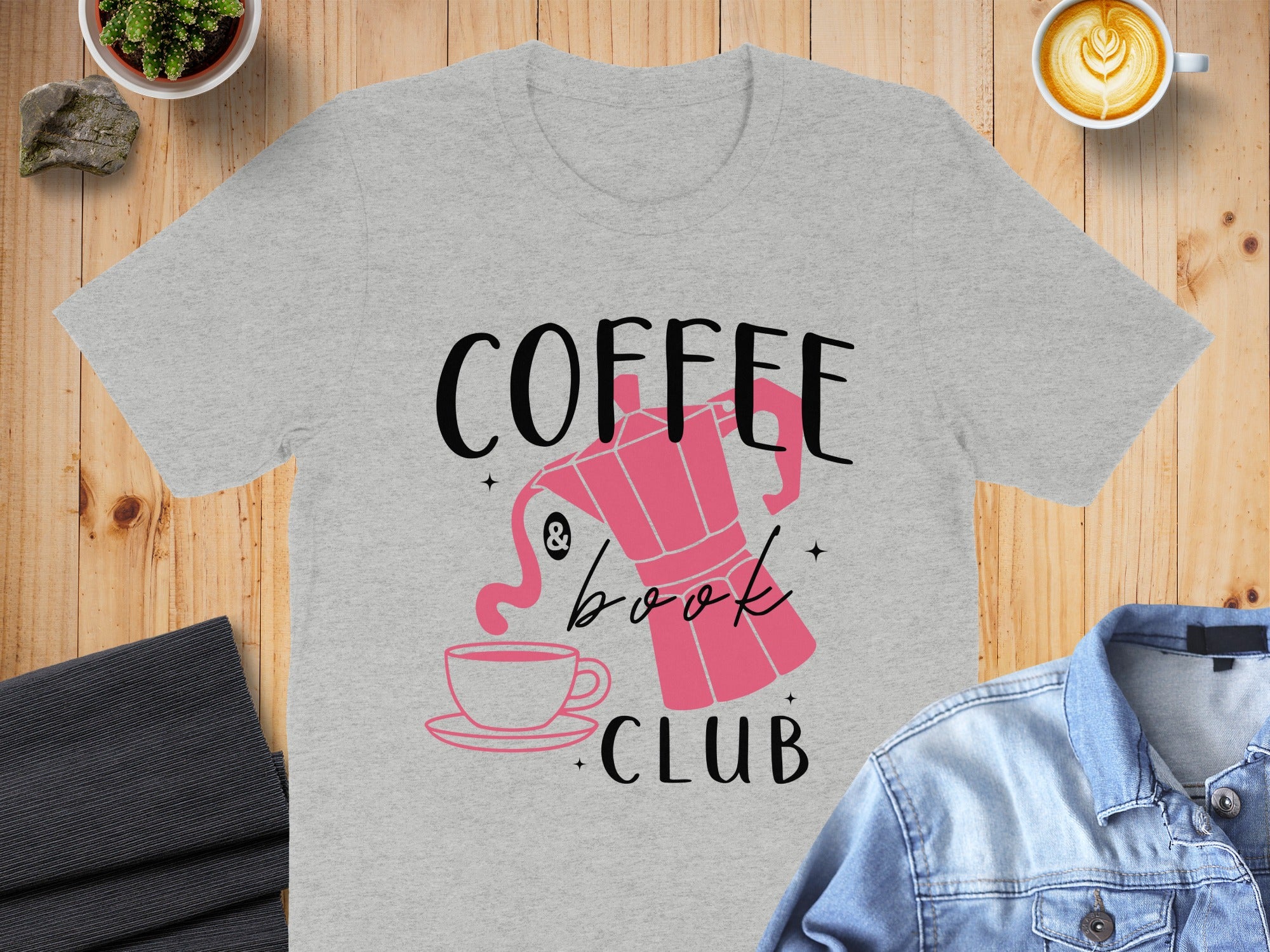 Grey t-shirt with "Coffee & Book Club" text and pink coffee pot and cup design.