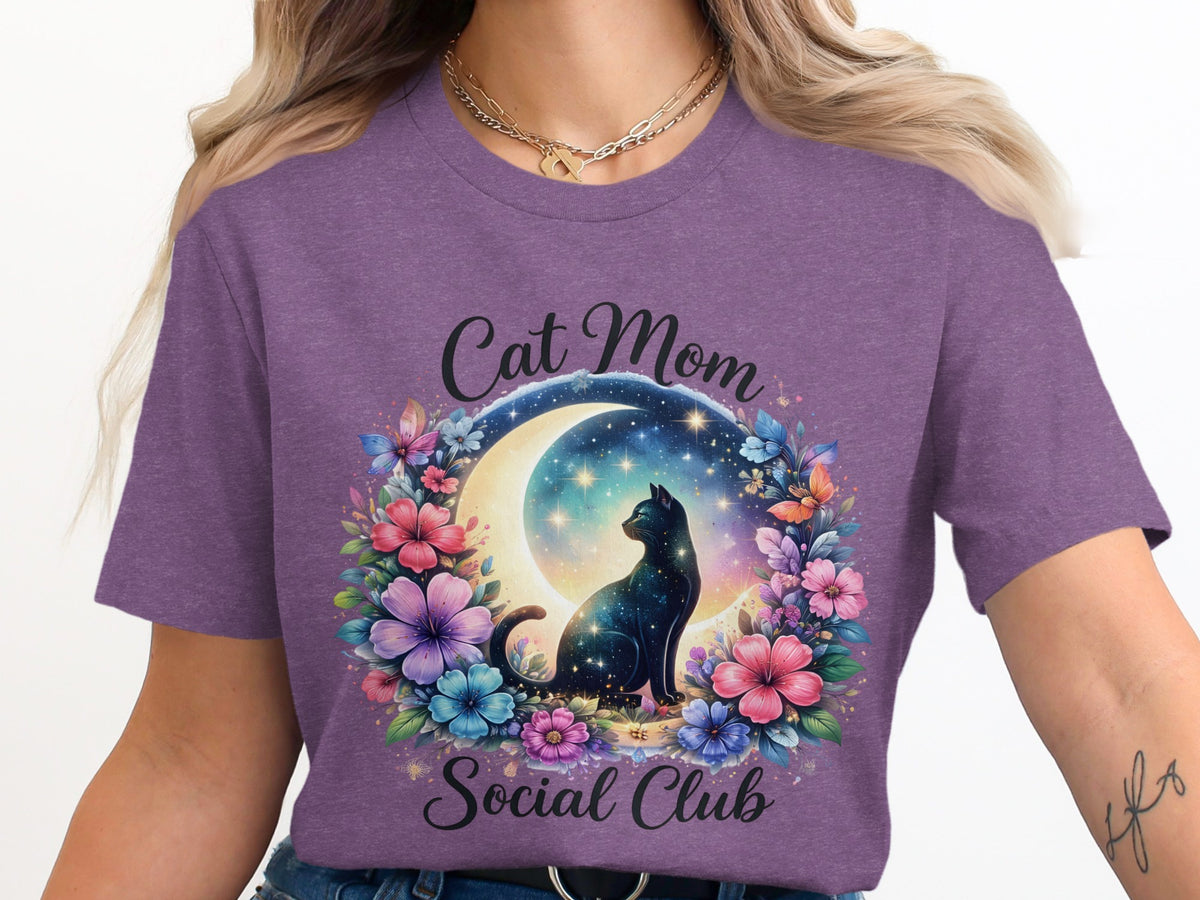 Cat Mom Social Club text with celestial cat and floral wreath on purple shirt.