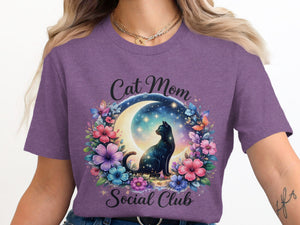 Cat Mom Social Club text with celestial cat and floral wreath on purple shirt.