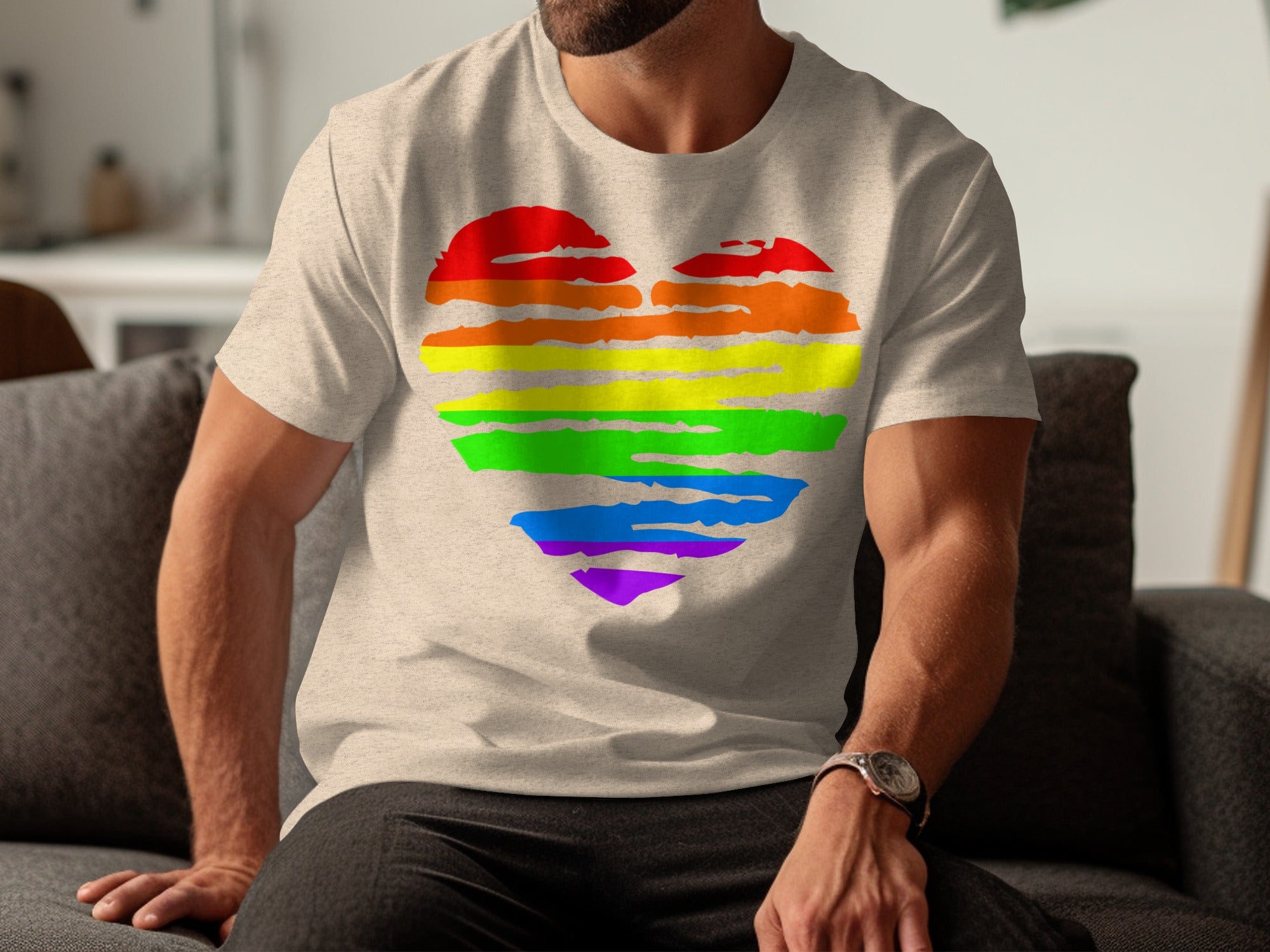 Light tan t-shirt with a rainbow heart graphic on the chest.