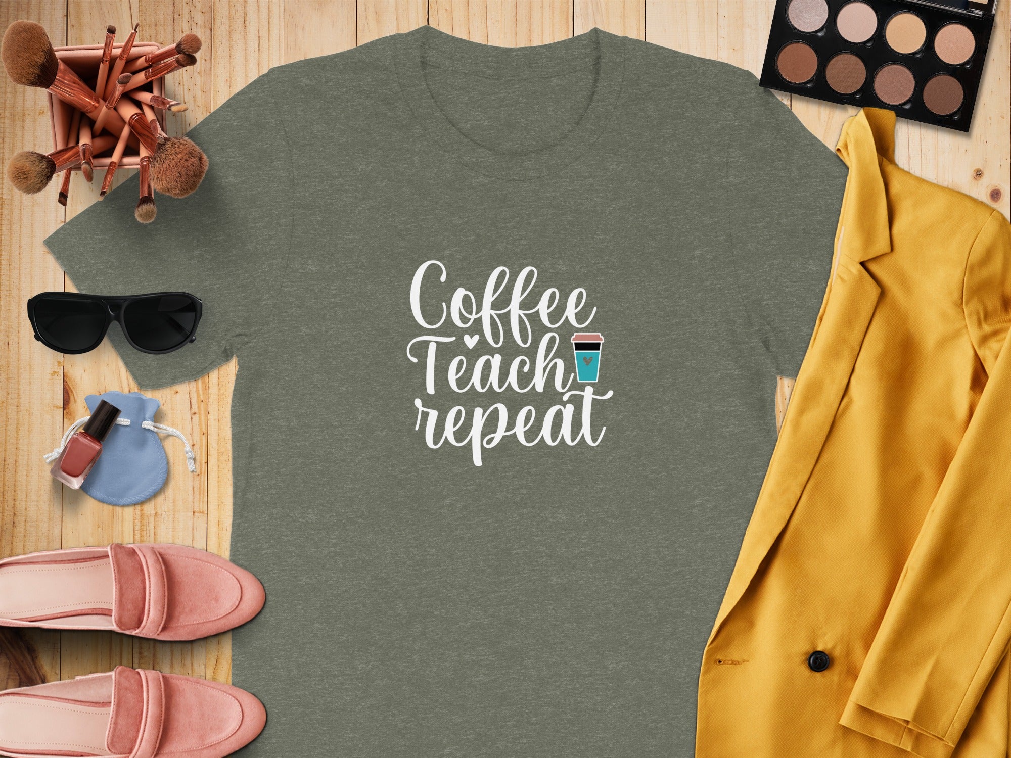 Green t-shirt with "Coffee Teach repeat" text and coffee cup graphic.