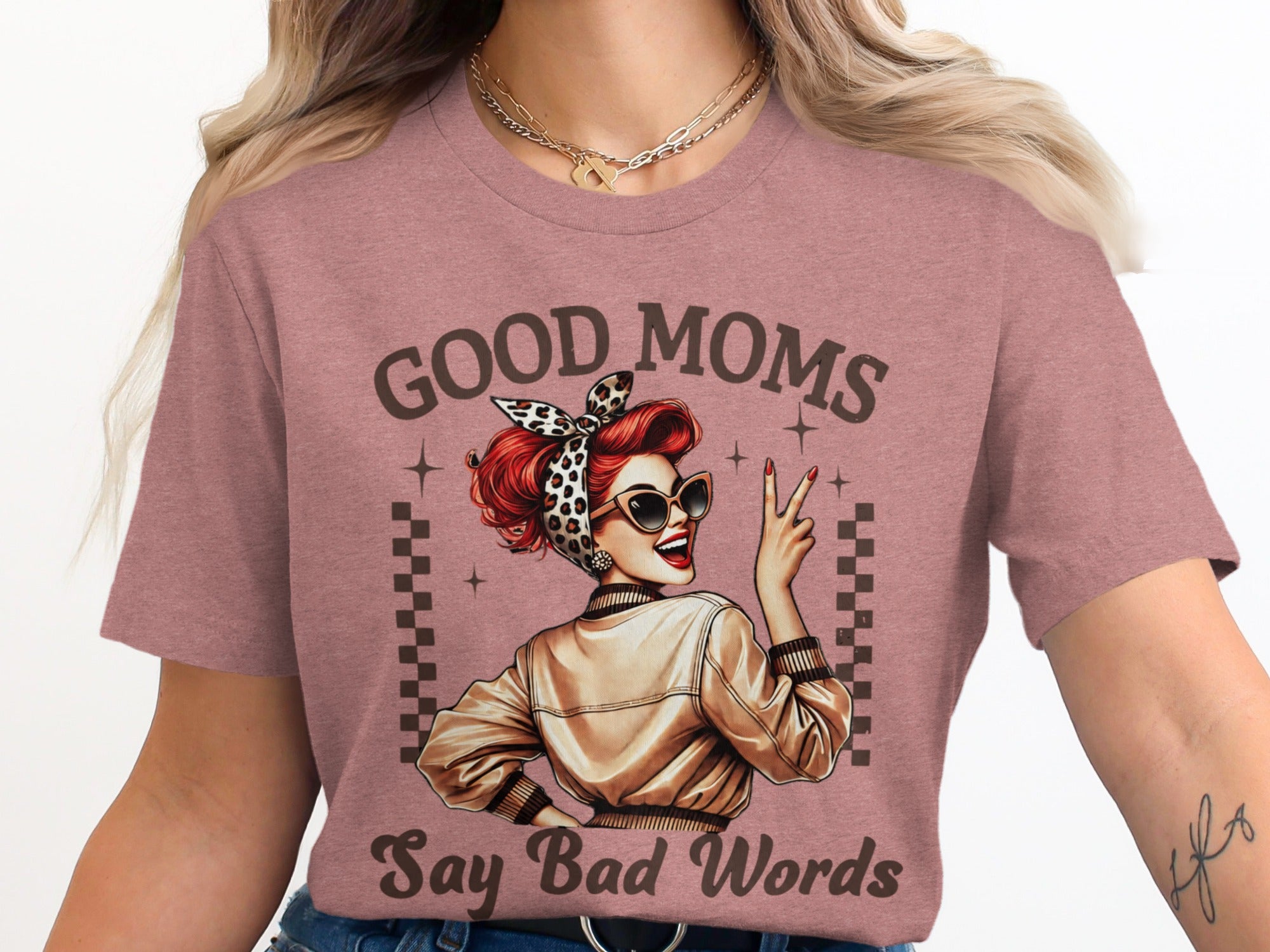 Brown text "Good Moms Say Bad Words" above a vintage graphic of a woman.
