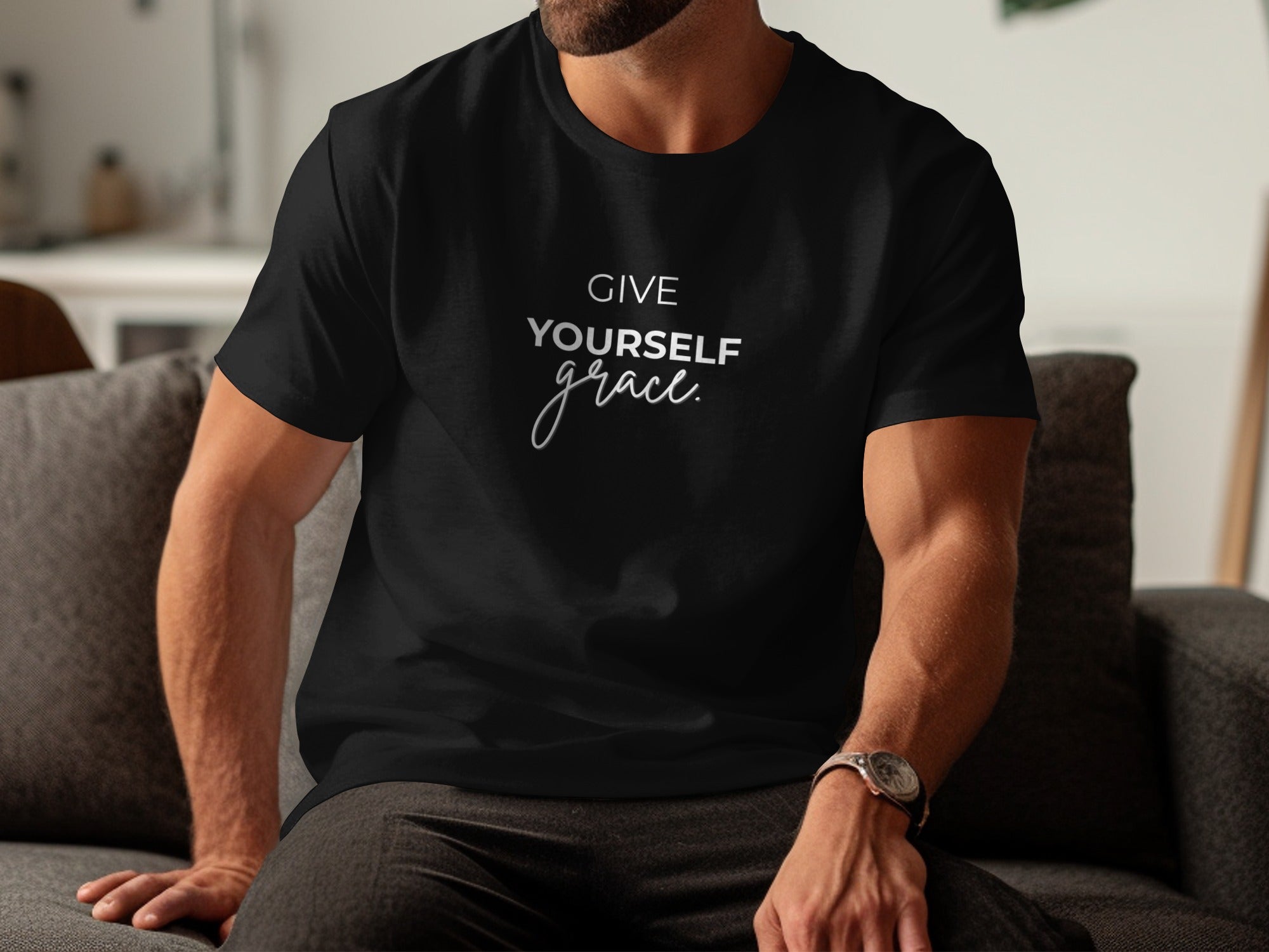 Black t-shirt with white text "GIVE YOURSELF grace" on the chest.