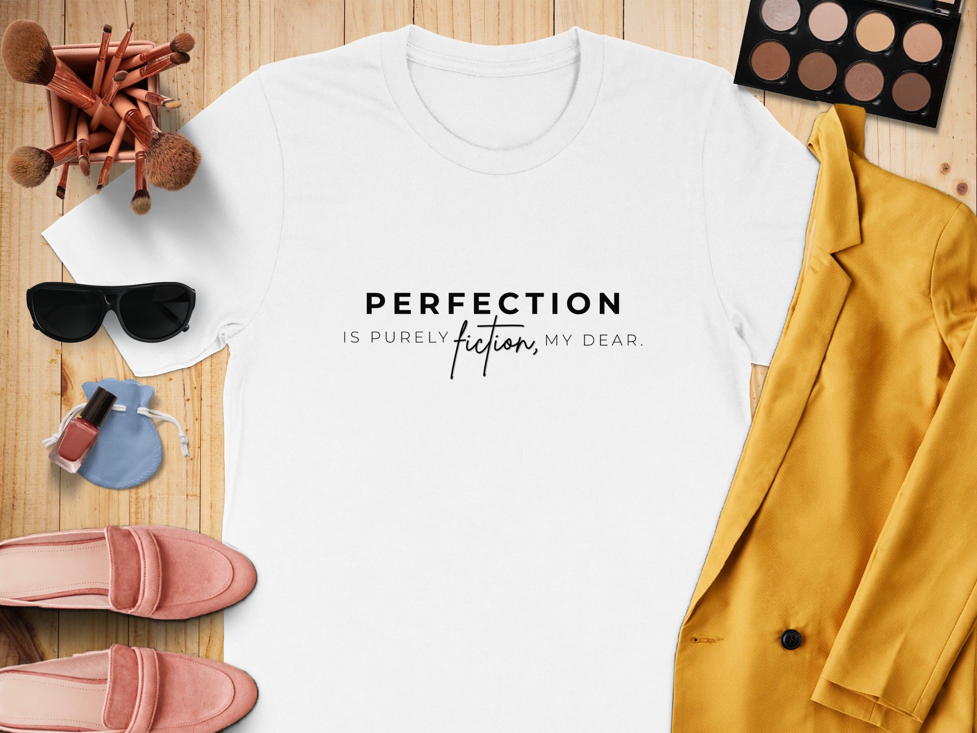 White t-shirt with "Perfection is purely fiction, my dear" text.