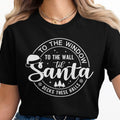 Black t-shirt with white graphic: "To the wall til Santa decks these halls"