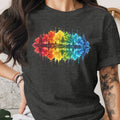 Dark grey t-shirt with a watercolor rainbow forest and reflection graphic.