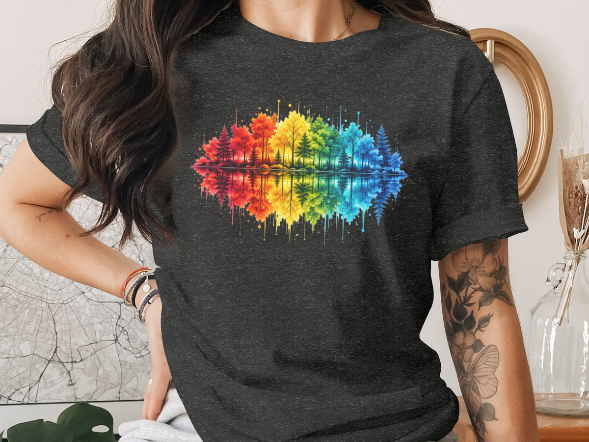 Dark grey t-shirt with a watercolor rainbow forest and reflection graphic.