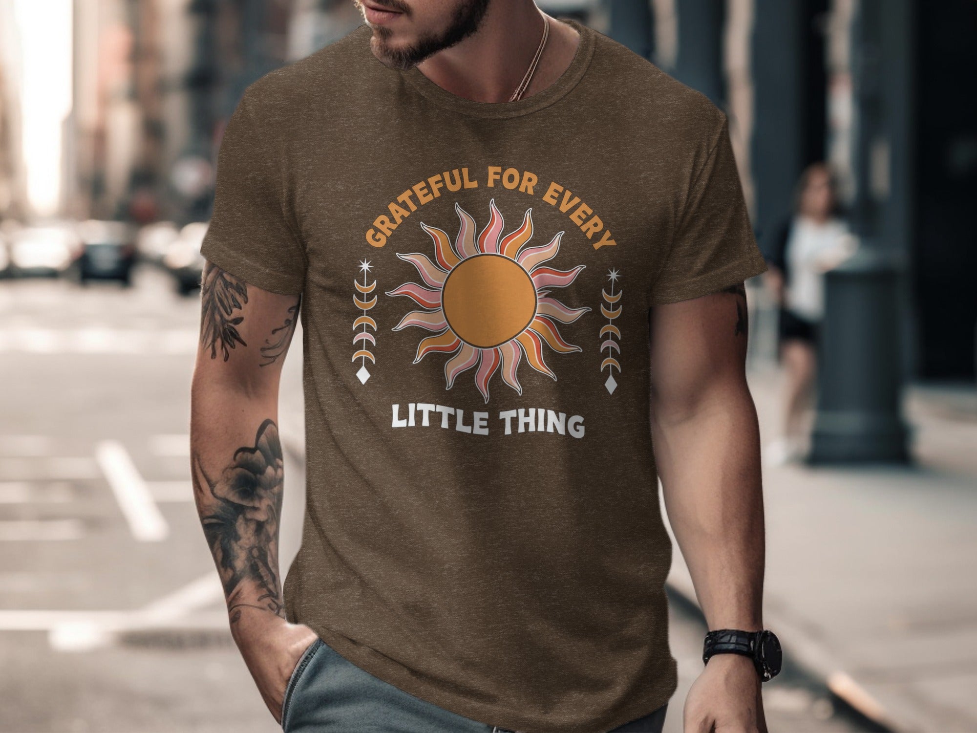 Brown t-shirt with "Grateful for Every Little Thing" text and a sun graphic.