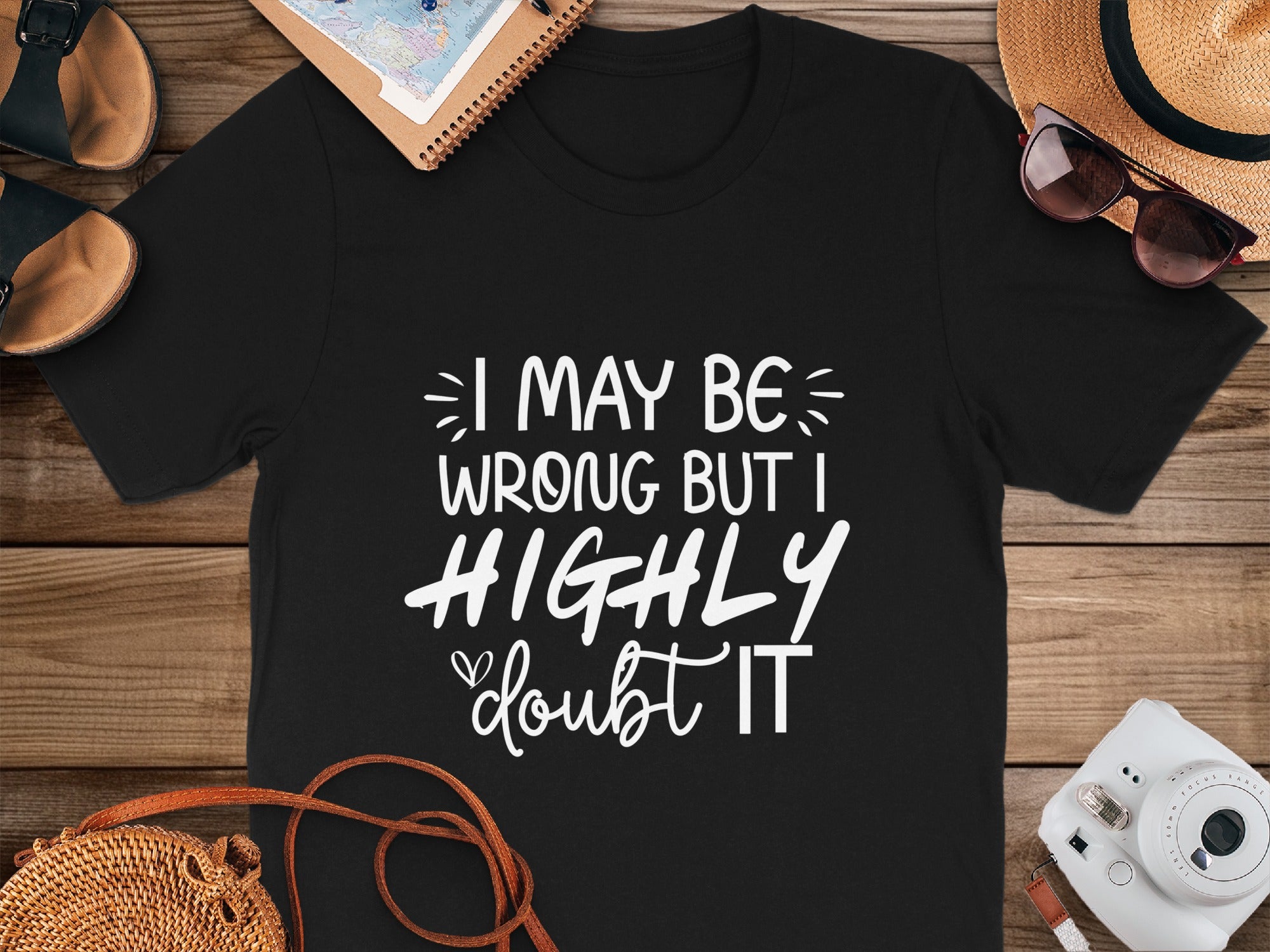 Black t-shirt with white text: "I MAY BE WRONG BUT I HIGHLY doubt IT."