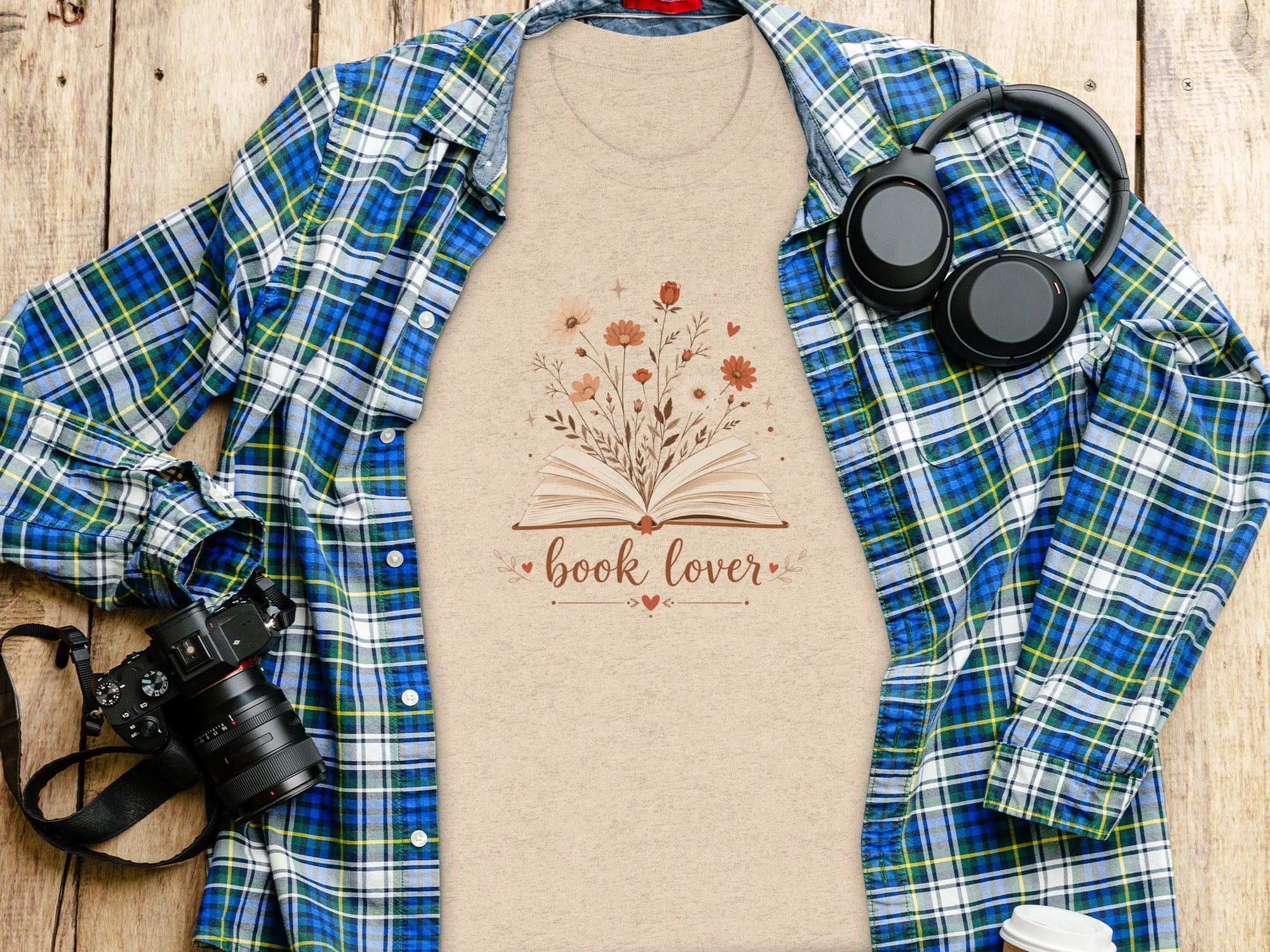Peach t-shirt with open book and flowers graphic that reads "book lover."