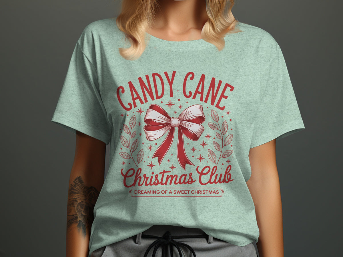 Light green t-shirt with "Candy Cane Christmas Club Dreaming of a Sweet Christmas" text.