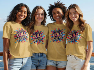 Four women in mustard yellow shirts featuring "Never Let Anyone Dull Your Sparkle" graphic.