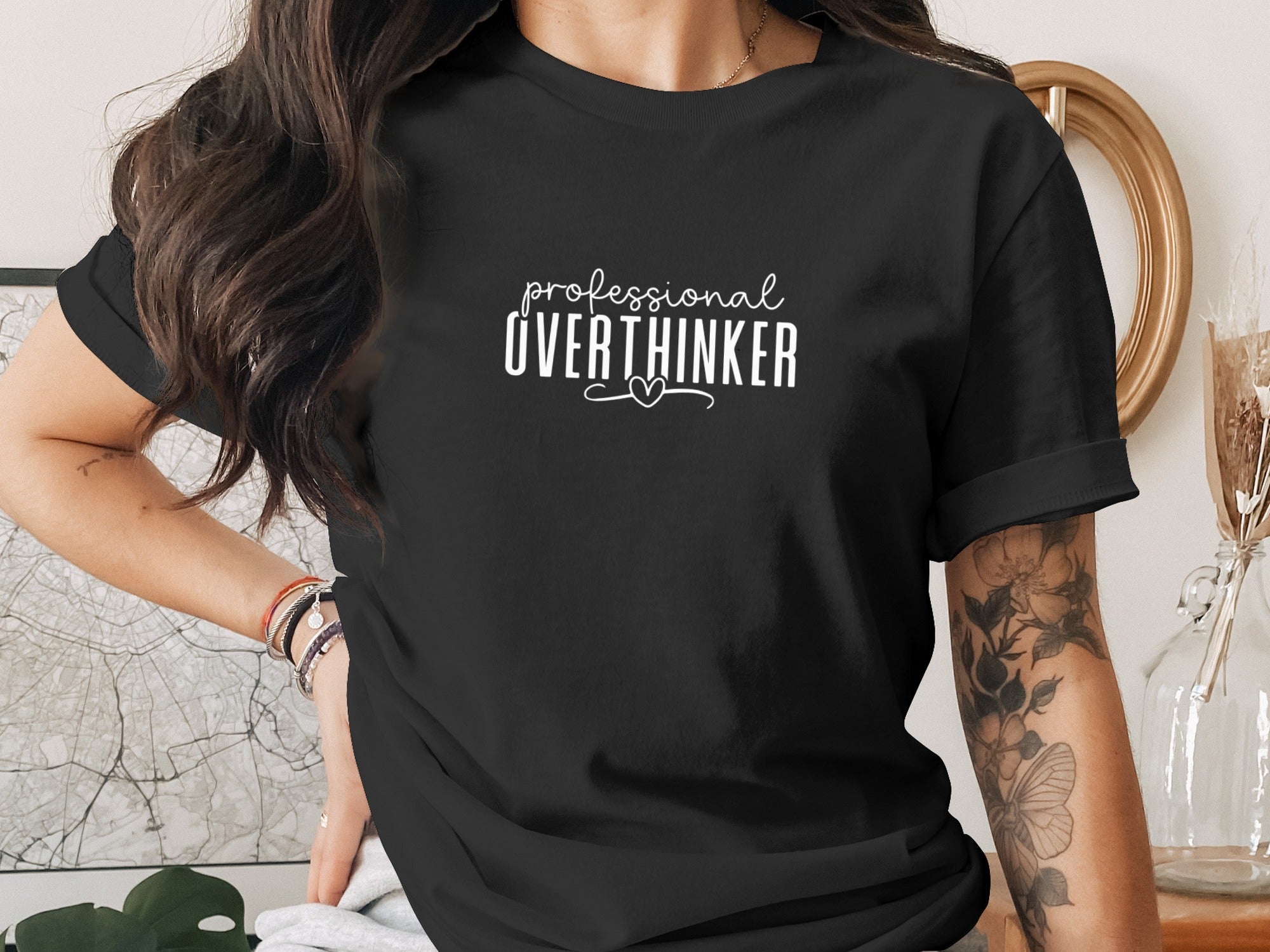 Black t-shirt with white text "professional OVERTHINKER" and a small heart.