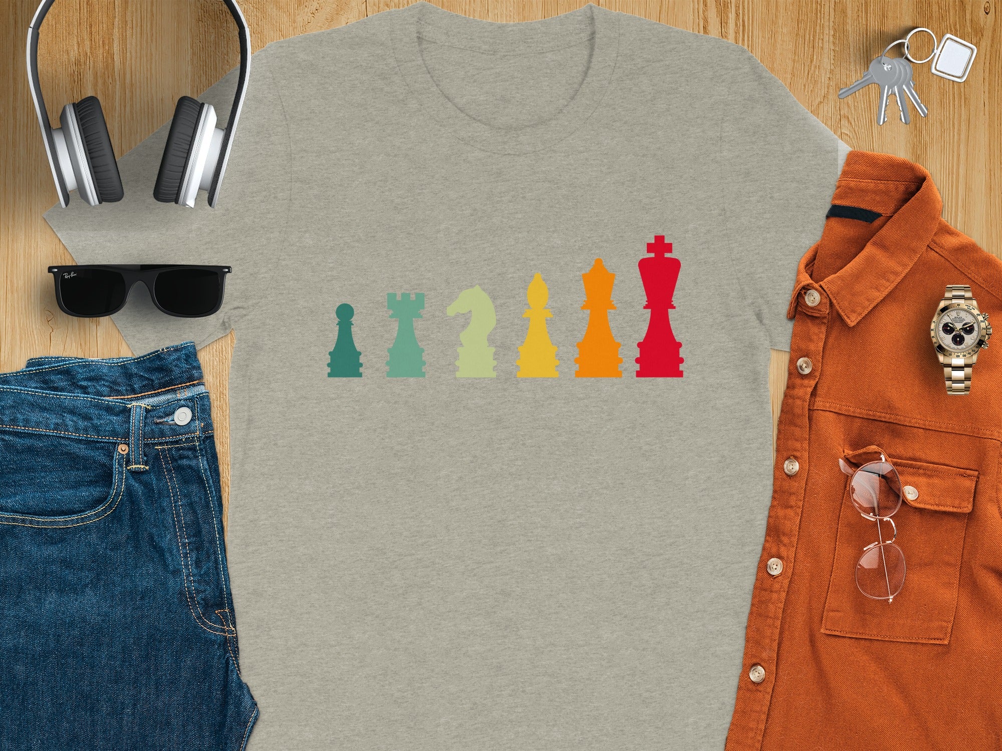 Gray t-shirt with colorful, retro chess pieces graphic.