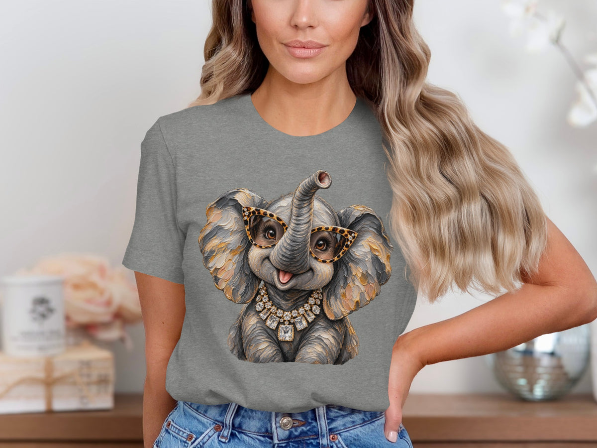 Gray t-shirt with a graphic of a cute elephant wearing glasses and a diamond necklace.