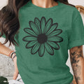 Green t-shirt with a black outline daisy graphic on the chest.