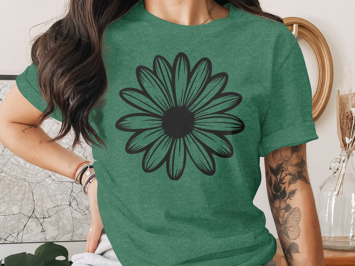 Green t-shirt with a black outline daisy graphic on the chest.