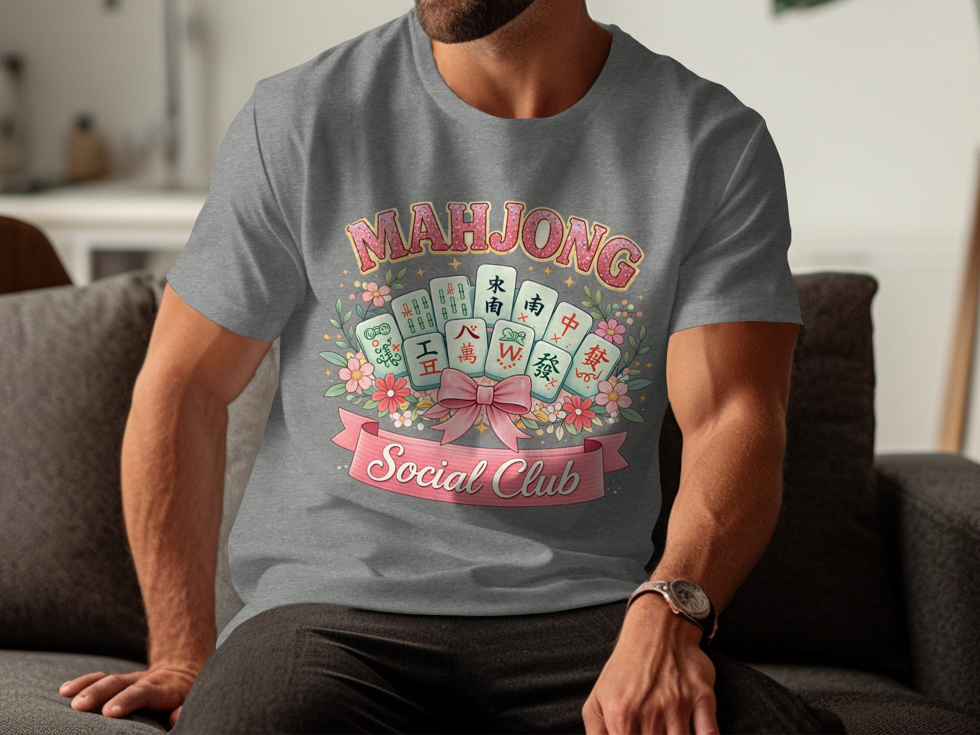 Gray t-shirt with a Mahjong Social Club graphic featuring tiles, flowers, and a pink bow.