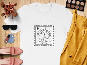 White t-shirt with a black stamp graphic of lemons reading "Amalfi Coast, Italy."