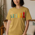 T-shirt with a vintage style graphic of colorful chess pieces lined up.