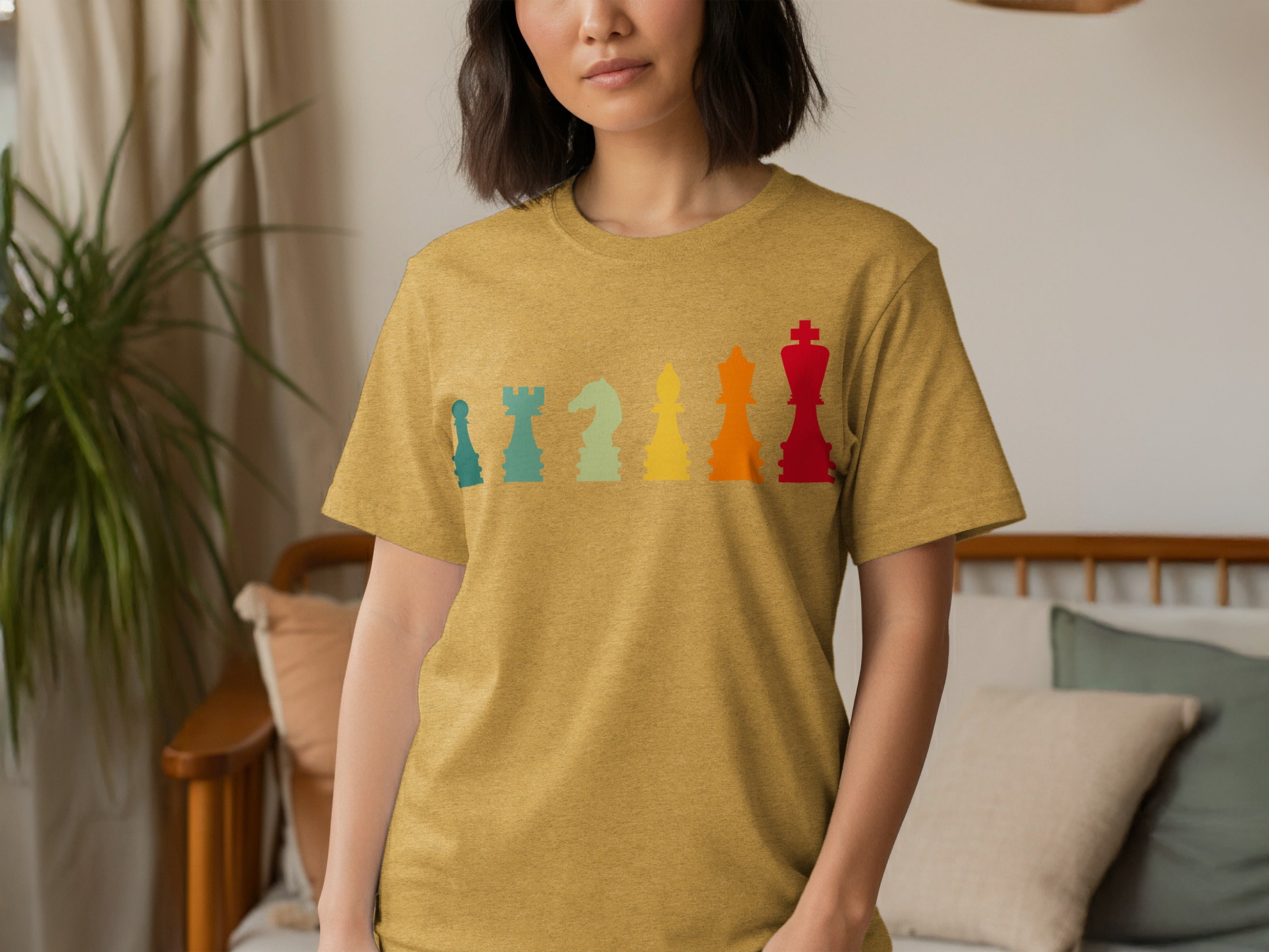 T-shirt with a vintage style graphic of colorful chess pieces lined up.