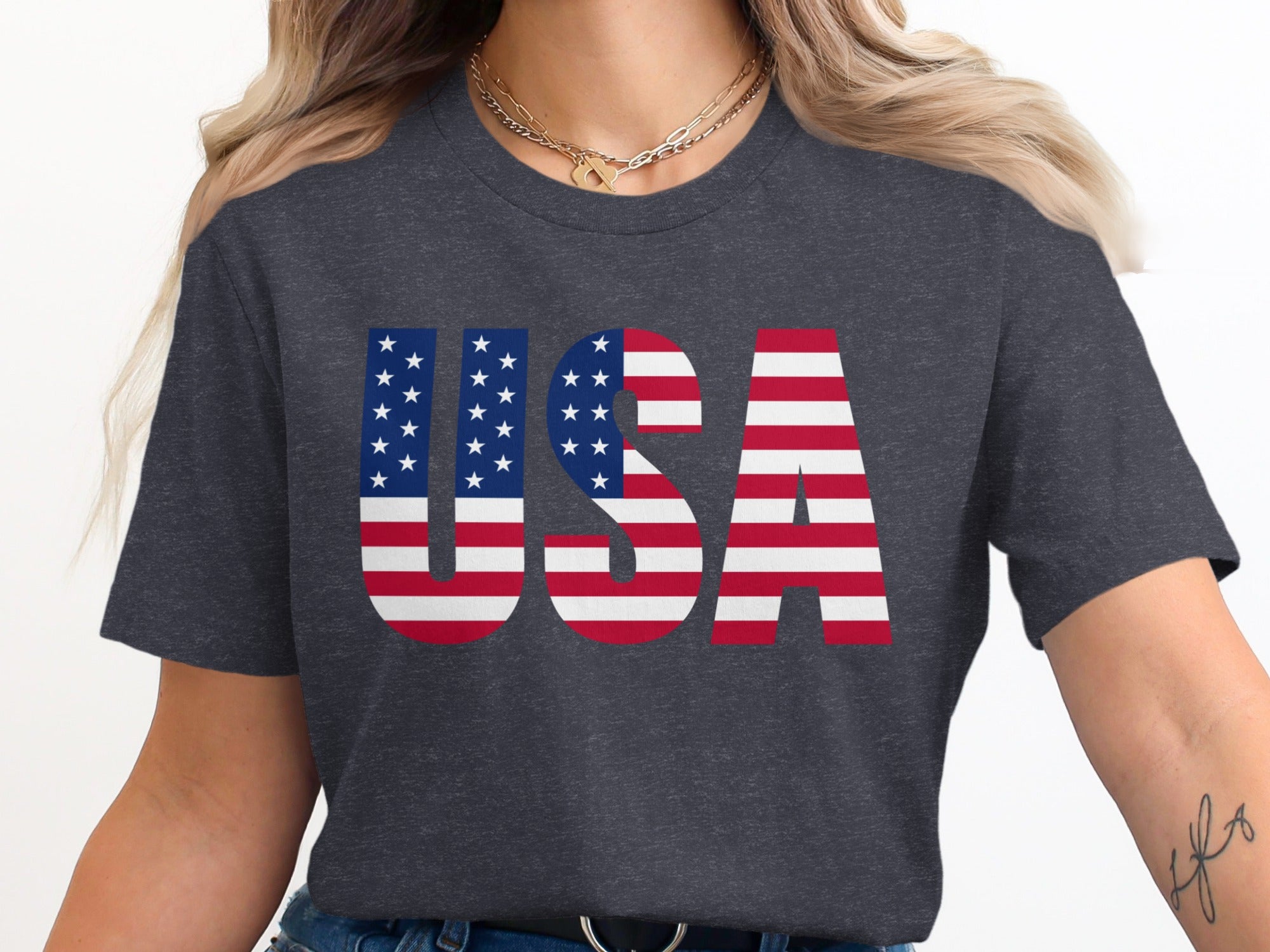 Dark grey t-shirt with bold "USA" text designed with the American flag pattern.