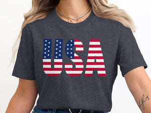 Dark grey t-shirt with bold "USA" text designed with the American flag pattern.