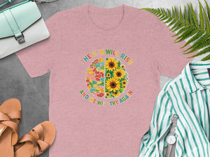 Pink t-shirt with circular graphic featuring sunflowers and a patchwork brain, saying text.