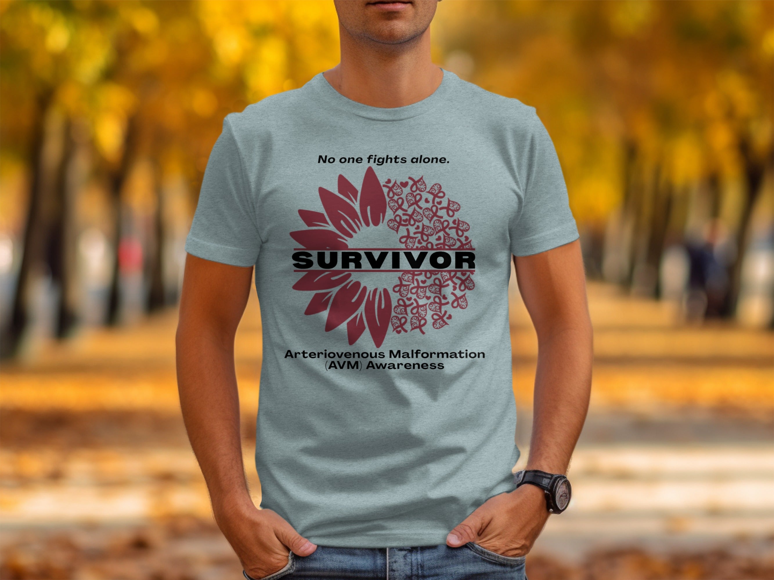 Survivor t-shirt with sunflower design, ribbon accents, and text for Arteriovenous Malformation awareness.