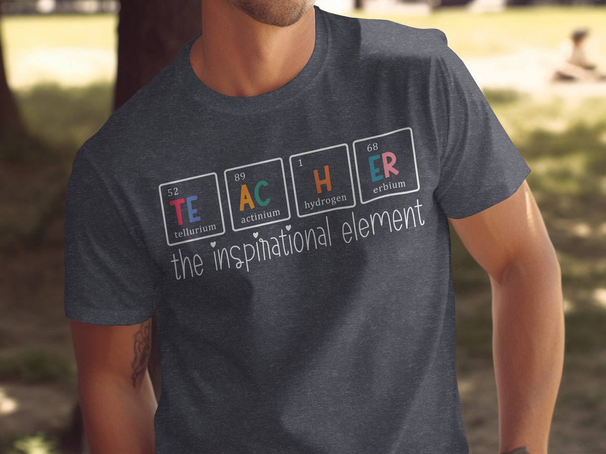 Dark grey t-shirt with "TEACHER" spelled with periodic table elements and "the inspirational element" text.