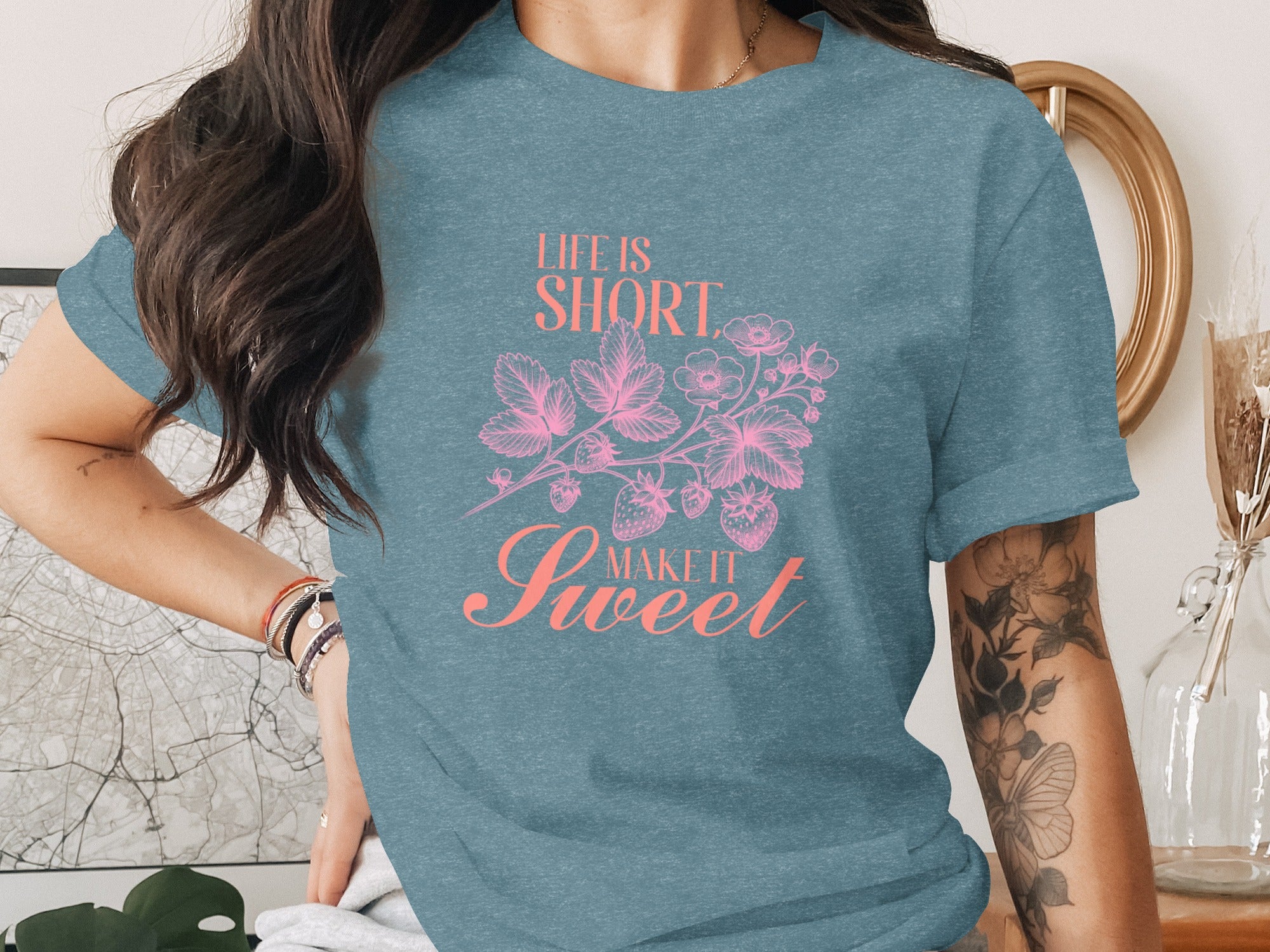 Teal t-shirt with pink text "LIFE IS SHORT MAKE IT Sweet" and strawberry vine graphic.