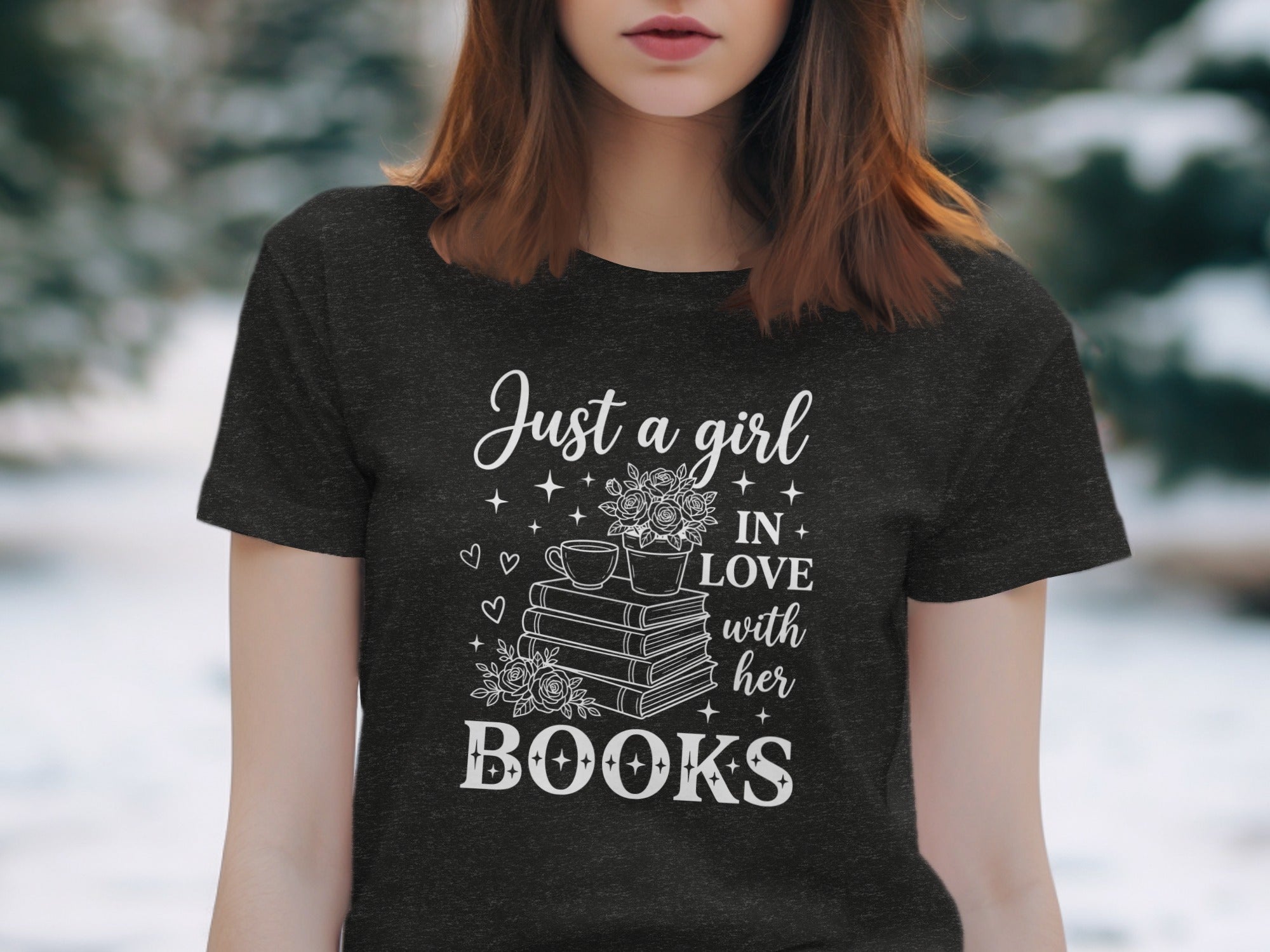 Dark t-shirt with white text "Just a girl IN LOVE with her BOOKS" and illustrations.